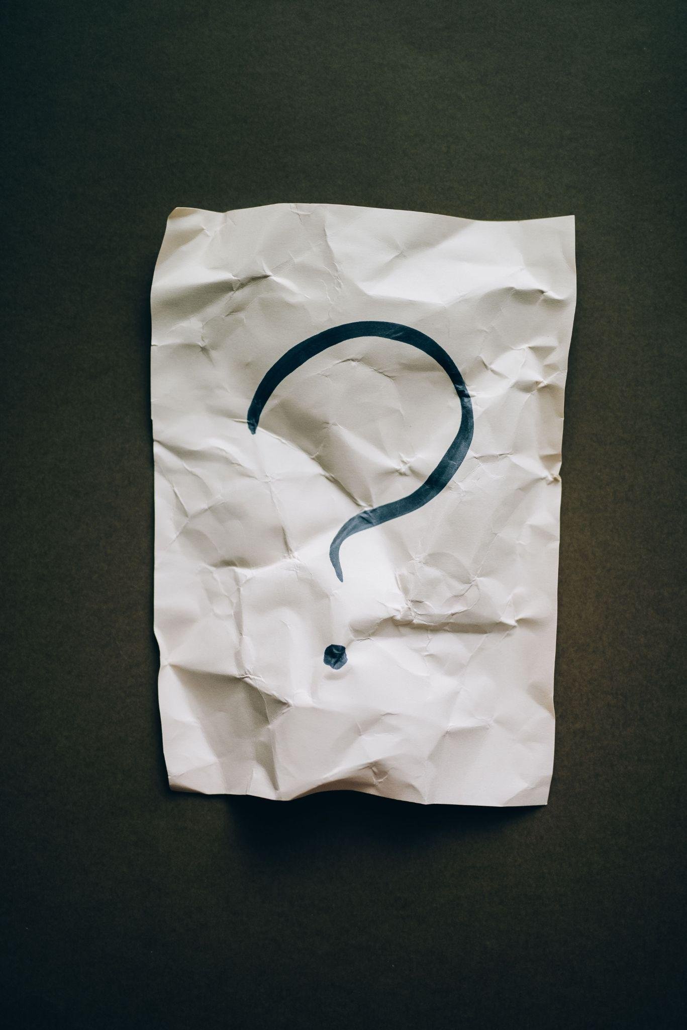Question mark on crumpled paper